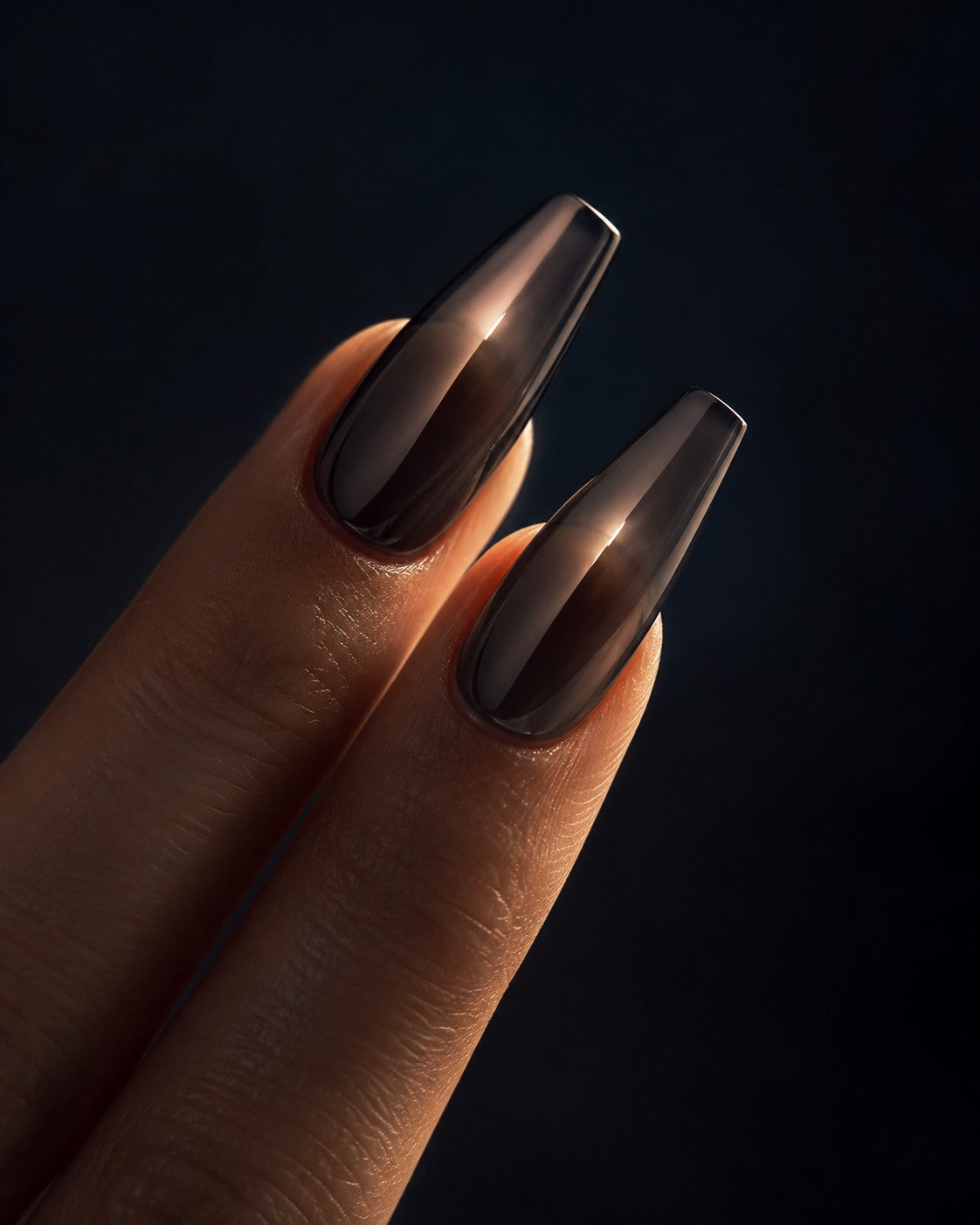 Long coffin shaped press-on nails in smoky graphite with a glass gloss finish