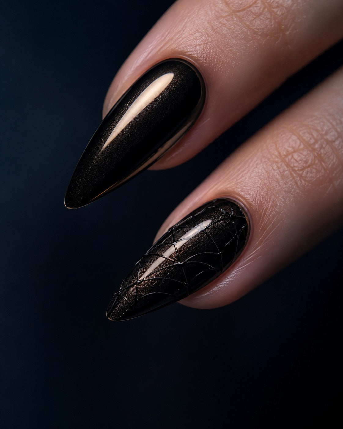 Black chrome stiletto Halloween press-on nails with a matte web accent nail