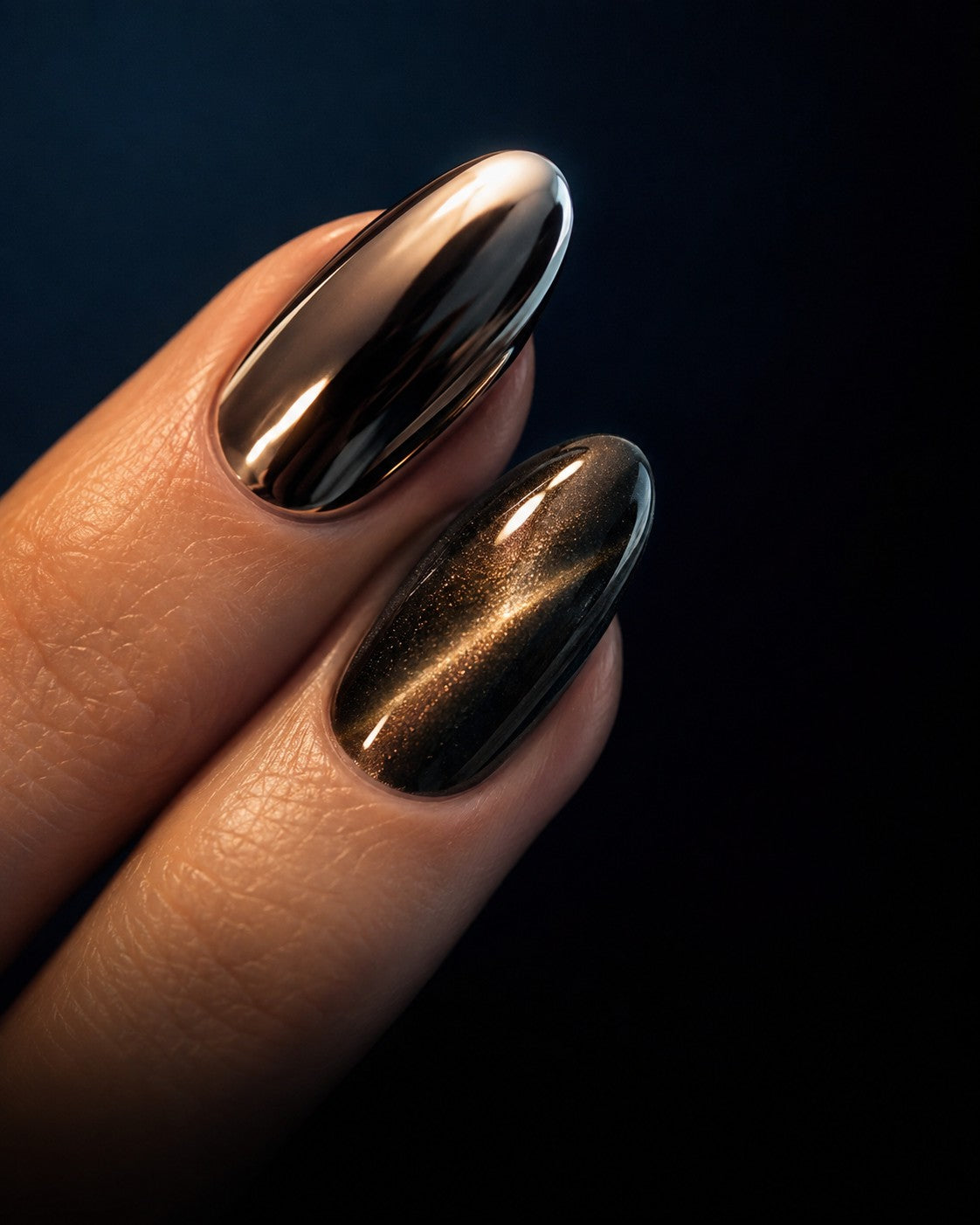 Mirror chrome and cat eye press-on nails on almond tips against a midnight background