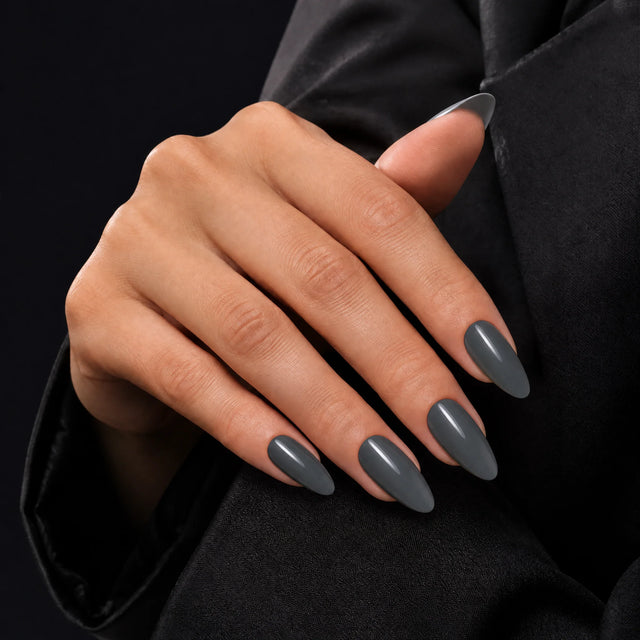 Slate Press-On Nails, Medium Almond — Main sur blazer noir (dos de main)